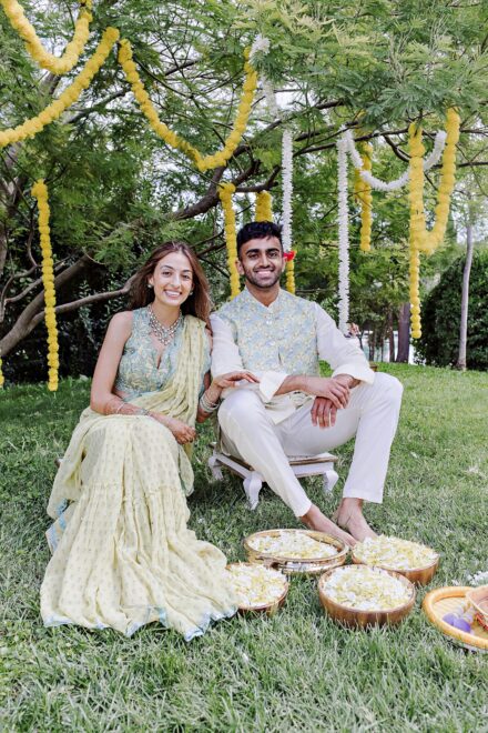 Bright yellow marigold decorations and bowls of turmeric prepared for the Haldi ceremony in Rome.