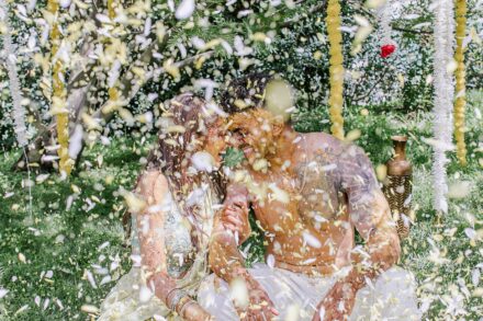 Guests playing with bubbles and enjoying the festive atmosphere during the Haldi celebration in Rome.