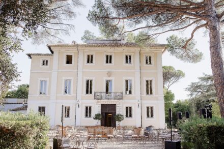 Villa Piccolomini decorated with vibrant flowers and lights for an Indian Sangeet celebration in Rome.