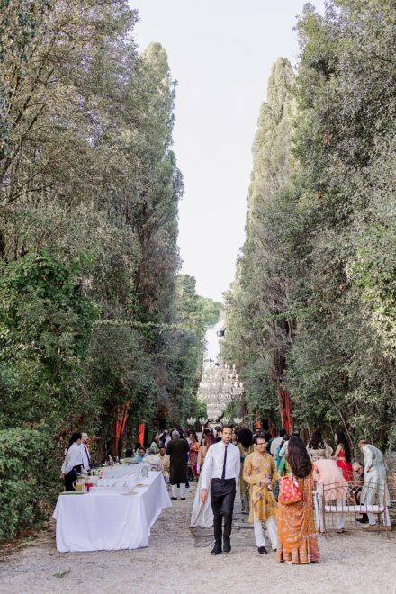 Reeya and Neil sharing an emotional moment surrounded by family during their Sangeet in Rome.
