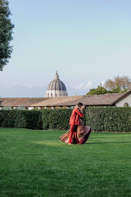 Romantic portrait of Reeya and Neil in traditional Indian attire before their Sangeet celebration in Rome.