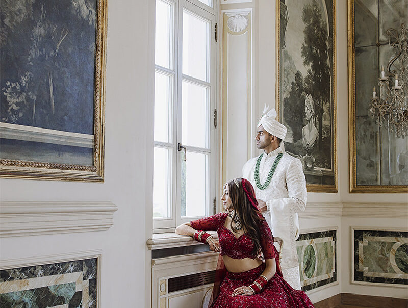 Reeya and Neil during their wedding at Villa Miani in Rome, dressed in elegant Indian attire, captured by Cossu Photography.
