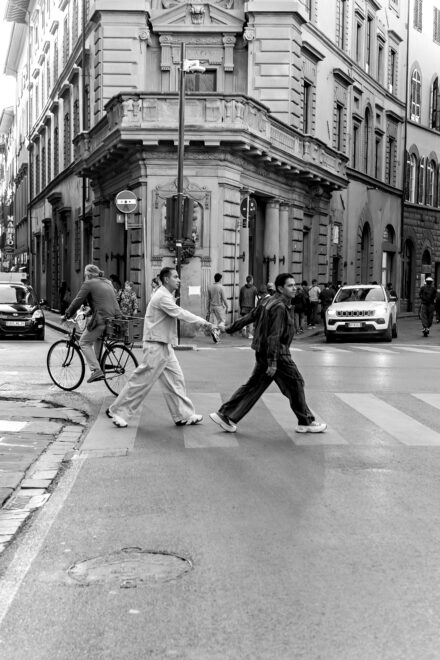 Candid moment of Lalo and Xavi exploring the streets of Florence during their pre-wedding session — laughter, love and Italian charm in every frame.