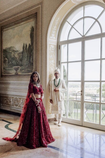 Bride and groom portrait inside Villa Miani, blending Indian tradition with Italian elegance.
