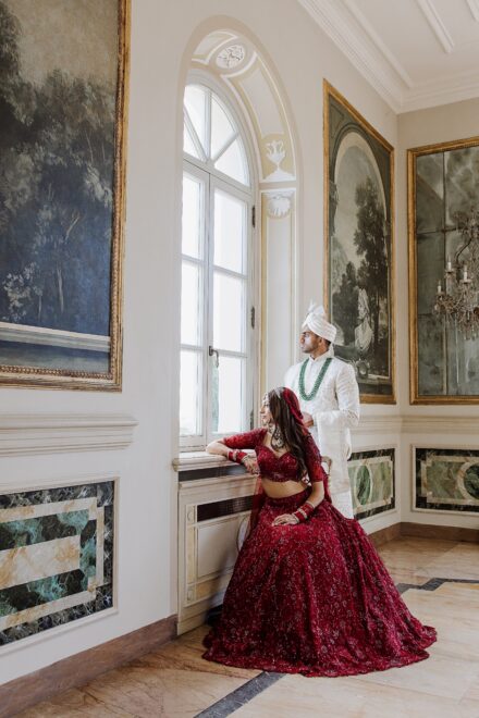 Bride and groom portrait inside Villa Miani, blending Indian tradition with Italian elegance.