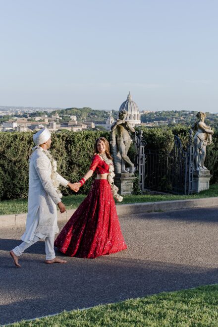 Bride and groom portrait inside Villa Miani, blending Indian tradition with Italian elegance.