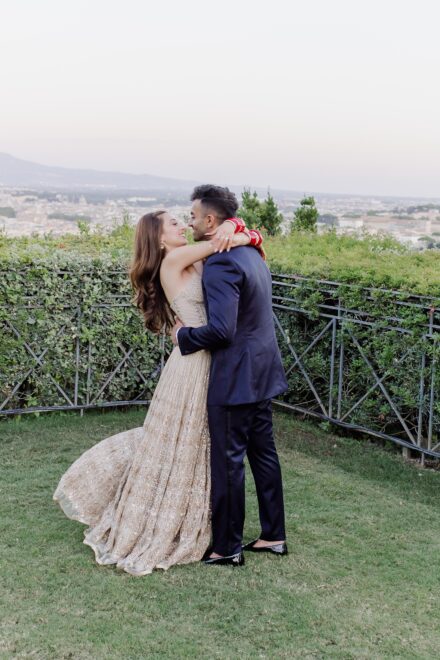 Bride and groom portrait inside Villa Miani, blending Indian tradition with Italian elegance.