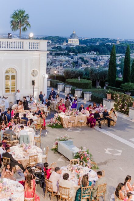 Guests enjoying dinner and toasts during Reeya and Neil’s wedding reception at Villa Miani, Rome.
