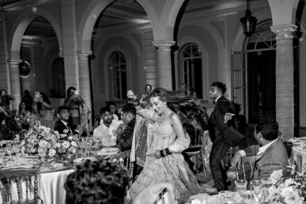Guests enjoying dinner and toasts during Reeya and Neil’s wedding reception at Villa Miani, Rome.