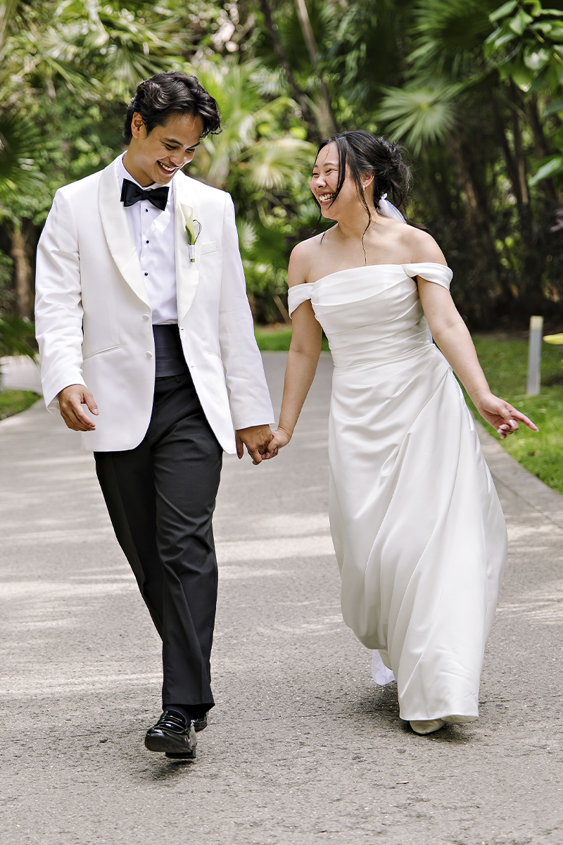 Wedding photographer Tuscany capturing bride and groom walking together in Italy