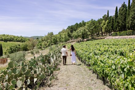Dan and Sophie walking through the vineyards before the surprise proposal