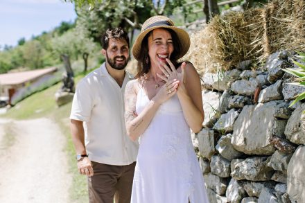 Sophie showing her engagement ring beside Dan in Tuscany